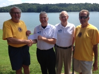 Lion President Roeber presents a check to WATeR